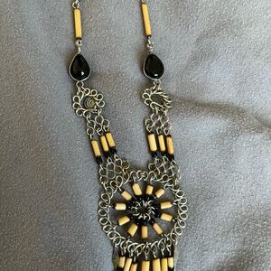 Intricate Black and Gold Necklace with Central Pendant